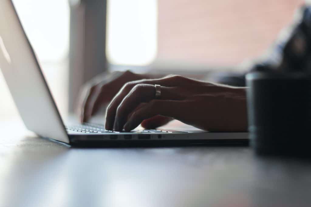 thomas-lefebvre-gp8BLyaTaA0-unsplash Man doing SEO on his laptop.